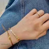 Französische Mode Instagram Nische minimalistische Persönlichkeit Titanium Stahl Gold plattierte triumpale Bogengewebewebkordelarmband für Frauen