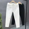 Jeans masculin créateur de luxe à la mode masculine blanc et noir ultra-mince adapté au pantalon de jean élastique de style coréen