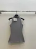 Dames T-shirtontwerper Early Spring Nieuwe Loe High Ding Koreaanse stijl Minimalistische nek Taille Wrap Solid Color Versatiele mouwloze gebreide tanktop 5DQ4