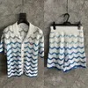 Herrendesigner Strickwege Polo -Hemd -Set Unisex 11 Stil Casablanca Hemd Perlenknopf Sea Welle Hollow Out Männer lässige Kurzärmel hochwertige Strickwaren Set