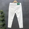 Jeans masculin créateur de luxe à la mode masculine blanc et noir ultra-mince adapté au pantalon de jean élastique de style coréen