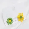 Boucles d'oreilles Stud Fashion Hollowing Daisy Baking Paint Alloy Gagnes Bijoux For Women Party Birthday Gift Accessoires