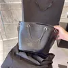 10A Fashion Luxury Womens en cuir Sacs de seau 2 lignes de design Machage de sac à main avec chaîne Haut-capacité Fashion Black Sac cool NXCG