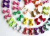 Accessoires 50pcs animaux de compagnie Chien de chien Hoies de chat Bows Clips de cheveux Modèles mixtes Hair Accessoires Conseils de chien Dog Tooth