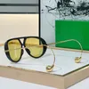 Des lunettes de soleil ovales concepteurs avec cadre d'acétate et revêtement de jambes en métal lourd pour la fonction anti-réfléchissante et la protection UV B1273 Lunettes de soleil haut de gamme neutres