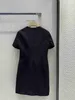 Vestidos casuales básicos de moda 24 primavera/verano Nuevo decoración de lazo de lazo redondo de cuello redondo de manga corta minimalista pequeña edición falda corta negra