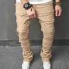 Мужские джинсы Стильные мужчины винтажные хип -хоп Складированные сплайсированные расстроенные стройные джинсовые брюки Стрип.