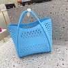 Fabrikverkauf Ladies Umhängetasche Einfache Feste Farbe Makaroon Fashion Food Basket Bag Picknick Einkaufswaschbad Damenhandtasche Süße Hollow Beach Bag 6006#