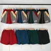 2023 American Niche Rhude Trendy Broidered Couleur Matching Ental Up Elastic Mens and Womens Casual Sports Shorts