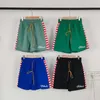 Rhude High Street Trendy Brandkontrast Farbe Spleißbrief bedruckte Shorts Sommer loser schneller Trockner Sportsand