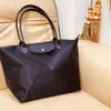 Sac à épaule mieux vendu nouveau 90% Ventes directes Small Produit grand produit grand manche en nylon à longue manche en nylon capacité maman fourrelle légère voyage un sac carré