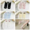 Chaussettes de femmes Softs Soft's Brepinable Japanese Cotton Middle Tube Tube Flower Cartoon Party