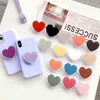 Mobiltelefoner Hållare Universal Heart Shaped Phone Socket Holder Finger Grip Bracket Support Telefon för iPhone 15 14 13 Pocket Socket Stand