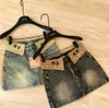 Designer de saias femininas New American Sweet Style Mumu Waist Hot Diamond Borderyer Design Lavado Antigo jeans alto Saias curtas para mulheres