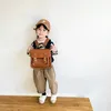 Kids Backpack Fashionable Koreaanse stijl Retro -jongens en meisjes schattige casual eenvoudige schooltassen schoolbenodigdheden 240424