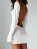 Femmes plage porte des femmes portent 2024 Nouvelle mode sexy semi massif couvre blanche Sarong Sumong Bikini Cover-ups Pareo Beach Mesh Backless Mini robe D240507