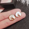 Luxury gold Carttrrie earrings Amulet Earrings Silver Plated 18k Rose Gold Peace Earrings Super Immortal Fashionable Style New White Fritillaria Earrings01