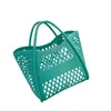 Fabrikverkauf Ladies Umhängetasche Einfache Feste Farbe Makaroon Fashion Food Basket Bag Picknick Einkaufswaschbad Damenhandtasche Süße Hollow Beach Bag 6006#