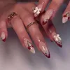 Uñas falsas 24 piezas de cereza roja uñas falsas de almendras francesas en uñas con decoración de la proa blanca cubierta completa punta de uñas falsas para mujeres T240507