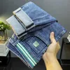 Ende hohe trendige blaue Jeans für Herren Frühling 2023 vielseitig leicht locker sitzende kleine Beinhosen