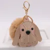 Keychains Fashion Sweet mignon cuir animal chien fausse boule de fourrure clés de la chaîne clés de pompom anneaux de filles bijoux de sacs