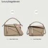 Bolsas de diseñador de alta gama de Loeiwe para mujeres bolsas de geometría empalmada minimalista de mano