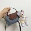 Best verkopende handtasroman 80% fabriek groothandel dames tas nieuwe mini handheld crossbody dumpling premium telefoon nul portemonnee lichtgewicht make -uptassen