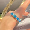 Europa y los Estados Unidos Water Water Lake Blue anillo topa tesoro tesoro en forma de huevo en forma de huevo de circonio azul marino anillo de regalos de hombres y mujeres diariamente sin caja