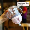 Tasses de plats ustensiles 250 ml Cartoon Small tasse adapté aux tout-petits et aux enfants Tapis d'apprentissage des bouteilles d'eau avec paille et poignée de bille de gravité Cupsl2405