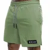 Shorts pour hommes Echt et tissu nylon féminin à cinq points de sport en vrac sèche rapide en dentelle solide même style été