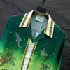 Summer masculino com mangas compridas designer de camisa Casablanca letra numérica carta impressão de botão de linha de linha única de gelo de gelo solto de gelo fino de roupas versáteis