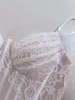 Robes décontractées de style français tempérament mondain de dentelle blanche sans manches en V