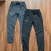 Trend estivo Designer di marchi sottili UA UA UA ESCENDI QUAST ESCENTIONE ALL'ALLENZA CHUASTICHE Pantaloni di abbigliamento sportivo Fitness Runnando i pantaloni lunghi con cerniera per piccoli piedi traspirabili