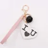 Keychains Lanyards Nouvelle Lettre créative de mode Sweet Love Pendant Pu Belt Bell Key Chain Pompom Girl Femme Bag des sacs de voiture