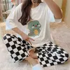 Moda-sono feminina Doce de pijamas Terno verão 2023 Novo desenho animado de mangas curtas Camiseta de calça longa Família use duas peças de pijama de duas peças