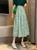 Jupes 2024 Été vintage vert décontracté imprimé élastique haute taille plissée midi jupe dames noires polyvalentes A-ligne longue pour les femmes