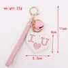 Keychains Lanyards Nouvelle Lettre créative de mode Sweet Love Pendant Pu Belt Bell Key Chain Pompom Girl Femme Bag des sacs de voiture