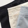 Pantaloni da donna pantaloni curvi in cotone alla moda con silhouette a doppio pulsante in vita a due punti casual a nove punti casual