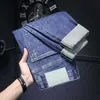 Span micro jeans maschile primavera e estate tasche inclinate semplici pantaloni lunghi ricamati a gamba ricamato ricamato