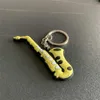 Keychains Lanyards Creative Classic Guitar Keychain Fashion Sile Musical Instruments Ornaments Accessory Keyring Bag Pertense para hombres Mujeres regalo
