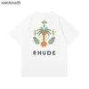 Rhude High End Designer Roupos para o direito de coco de coco impressão pequena casual manga curta e mulheres amantes de pescoço redondo solto de verão moda com 1: 1 tag original