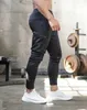 Calça masculina masculino escuro leggings correndo calças de jogging joggers strtwear calças de vários bolsos esportivos de treinamento de baixo