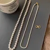 Double layered round bright pearl necklace niche stacked sweater chain light luxury neck chain detachable new style