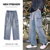 Męskie dżinsy Spring New Man Elastyczny talia ładunek w lupgy dżinsy wysokie strt spodnie proste Y2K Multi-Pieszerzy Modne spodni Y240507