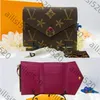Portafogli di alta qualità portafoglio di lusso Pochette Womens Porta borsetta portachiavi Designer Messenger Designer Pulsante Casa Chiave in pelle.