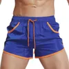 Mäns shorts Mens Sports Beach Shorts Swimming Pants Running Sports With Pockets Color Matching SPD Dry Gym Shorts Summer Swime H240508