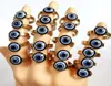 Hele 25 stcs Lot Vintage Blue Evil Eye Roestvrij staal Gold Punk Ring Women Accessoires Gift Men Retro Party Ring Uniek 27834701461