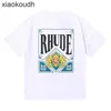 Rhude High End Designer Roupos para manga curta High Street Fashion Summer Men and Women Gênero Cartões grátis Impresso Caminhadas de algodão solto Moda com 1: 1 Rótulo original