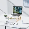 Stojak z laptopa wykonany z czystego materiału drewna może być używany do komputerów powyżej 14 cali. Ergonomiczny projekt oszczędza przestrzeń i zapewnia stabilne wsparcie