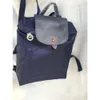 Luxury Bolsa Designer Backpack Backpack Bag Classic Dobing Nylon Versátil para comportar o lazer dos alunos de grande capacidade Travelfogt